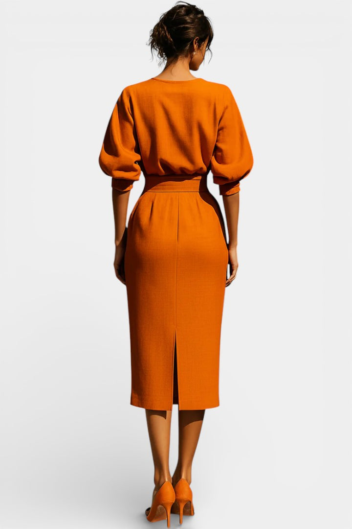 Stylish women's workwear sheath dress, elegant for the office, with boat neck, lantern sleeves, tapered hem.