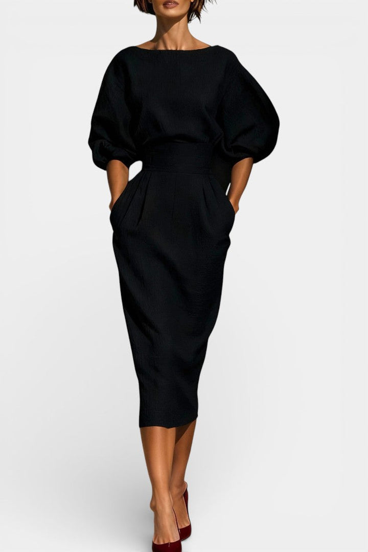 Chic women's formal sheath midi dress showcasing elegant lantern sleeves and a modern tapered hemline.