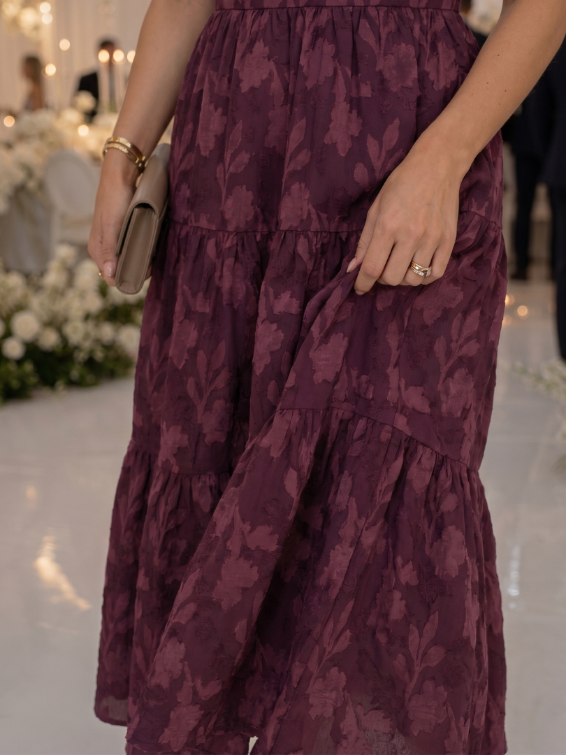 Occasion-ready women's floral textured midi dress. Short sleeves, square neck, flowy tiered skirt for elegant comfort.