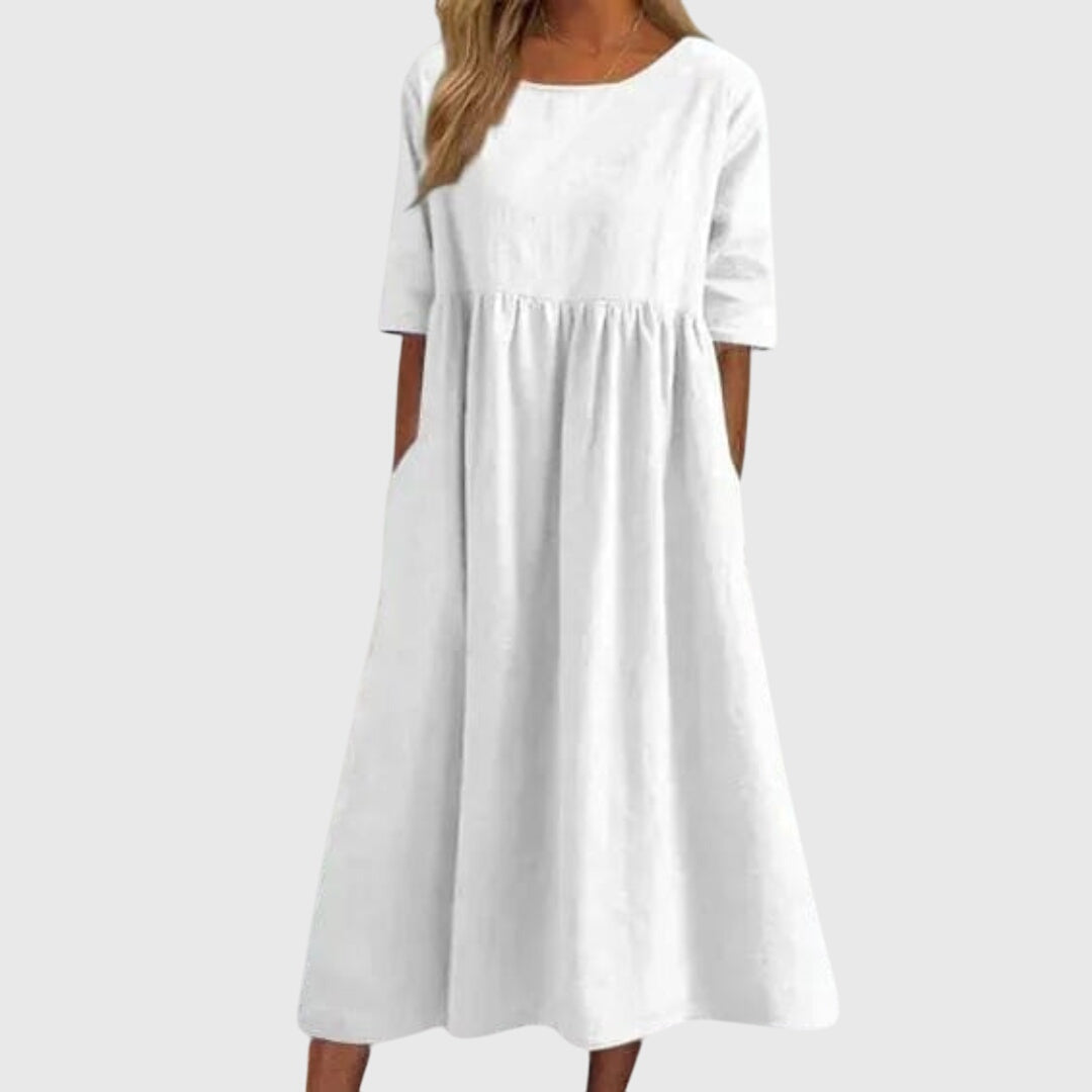 Elegant women's short-sleeve midi dress. Chic, versatile style for effortless summer fashion, day to night.