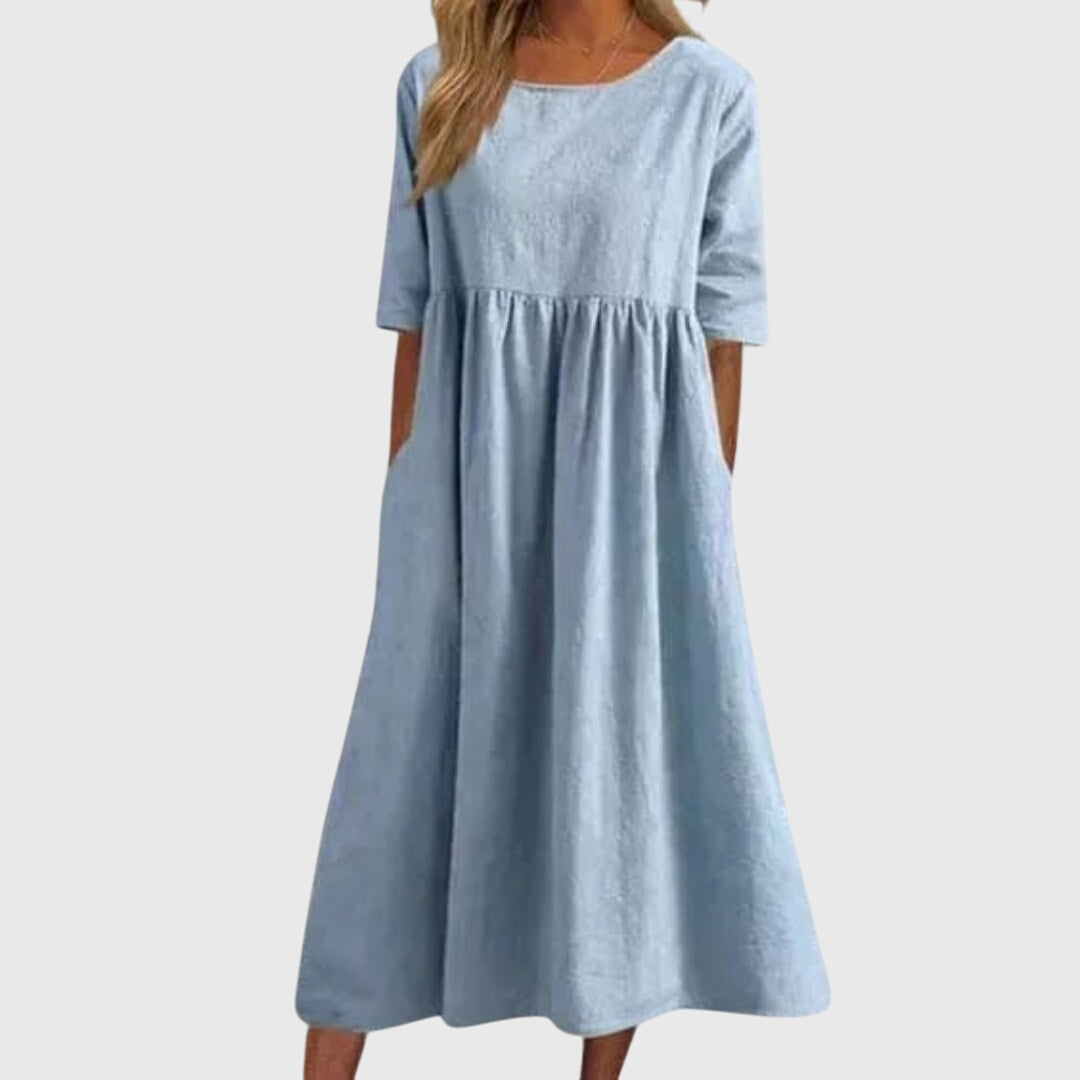 Flattering women's short-sleeve dress. Effortless chic midi style for versatile summer fashion and elegant occasions.