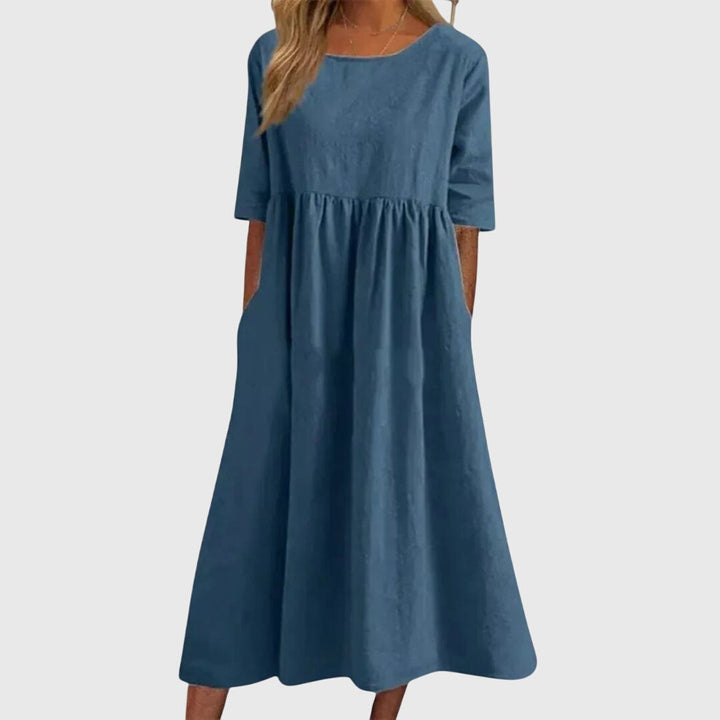 Versatile women's short-sleeve midi dress. Elegant day to night style, ideal for summer fashion & chic apparel.
