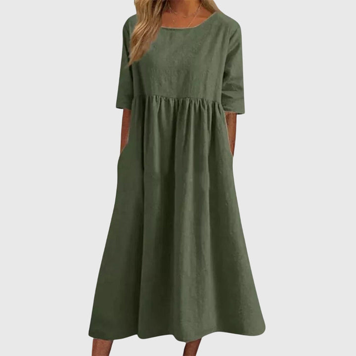 Effortless women's short-sleeve dress. Elegant midi design with a flattering fit for chic everyday or evening wear.