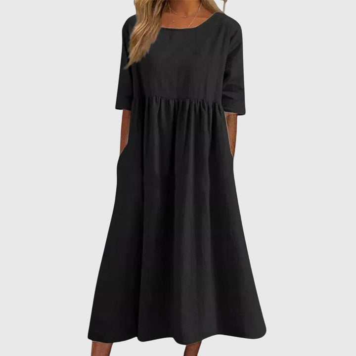 Stylish women's short-sleeve midi dress. Elegant & comfortable for versatile summer fashion, perfect day-to-night.