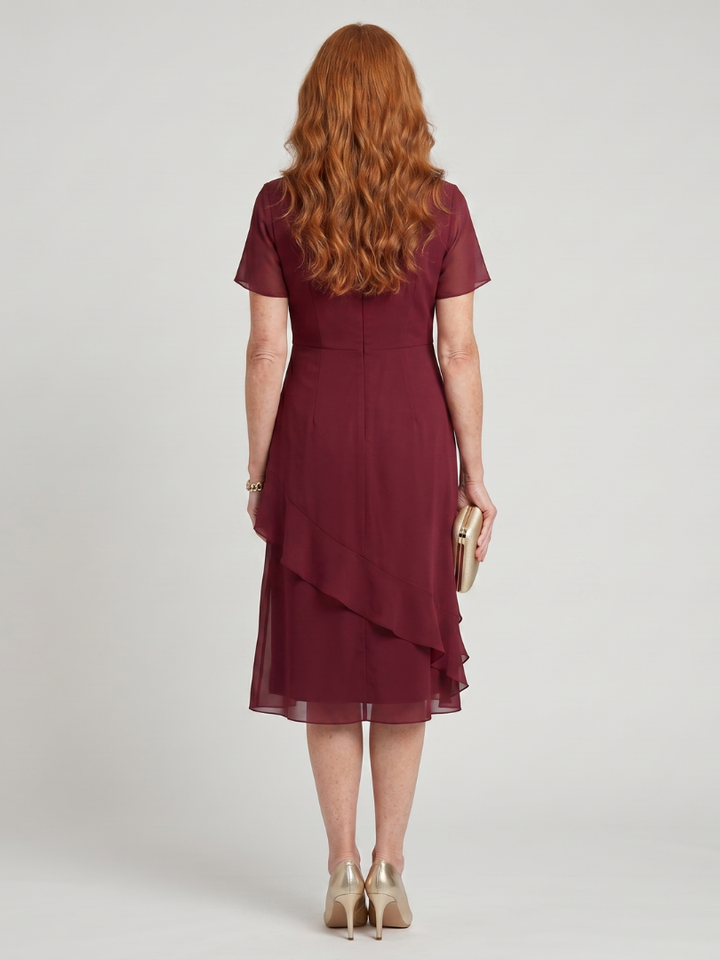 Versatile elegant short sleeve midi dress for women, flowy layered hem; ideal for various occasions.