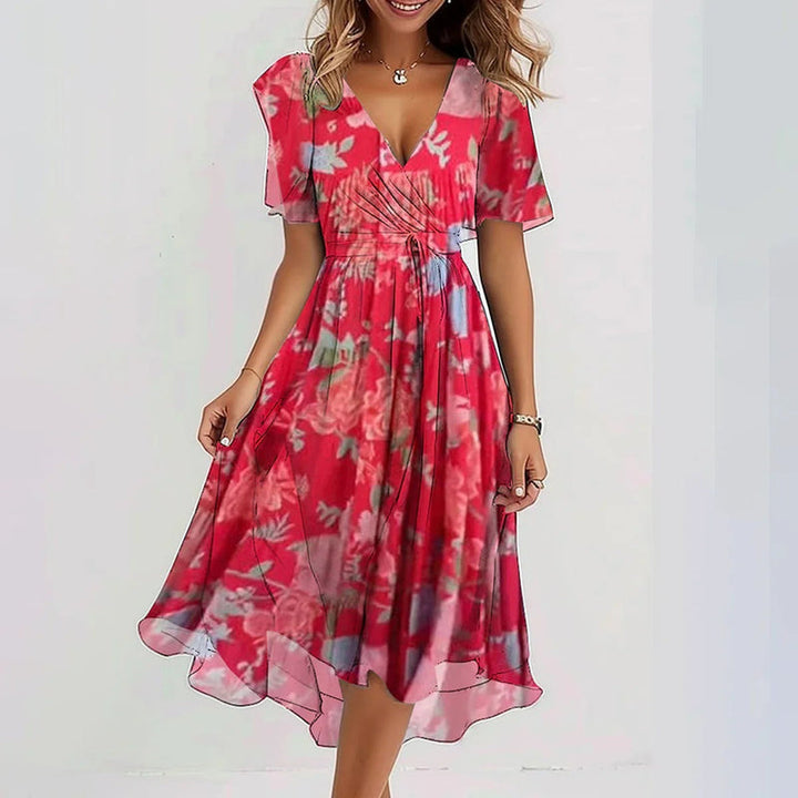 Versatile women's elegant printed midi dress with short puff sleeves, V-neck, and stylish asymmetrical hem.