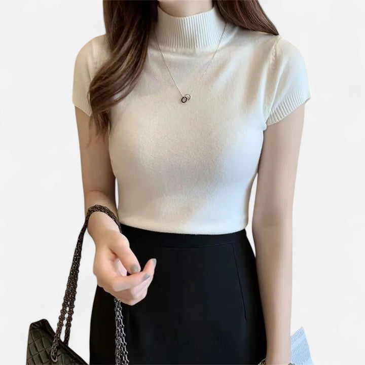 Sophisticated women's short-sleeve turtleneck blouse, perfect for a polished & elegant outfit.