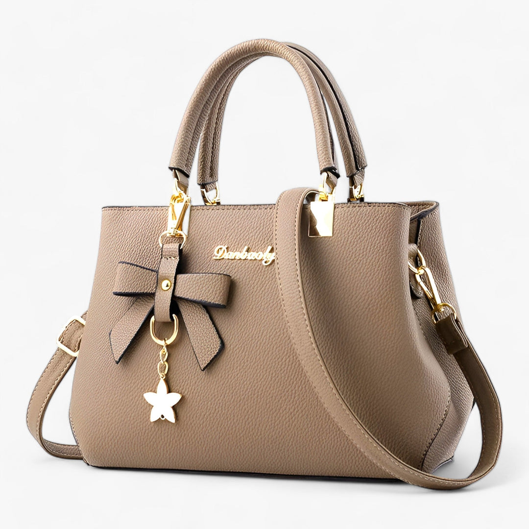 Elegant women's shoulder bag, perfect for business meetings & daily use. Features sleek design & quality material.
