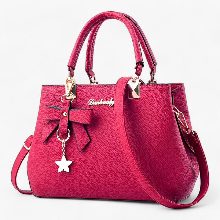 Women's elegant shoulder bag, functions as a stylish crossbody or handbag for business & daily fashion needs.