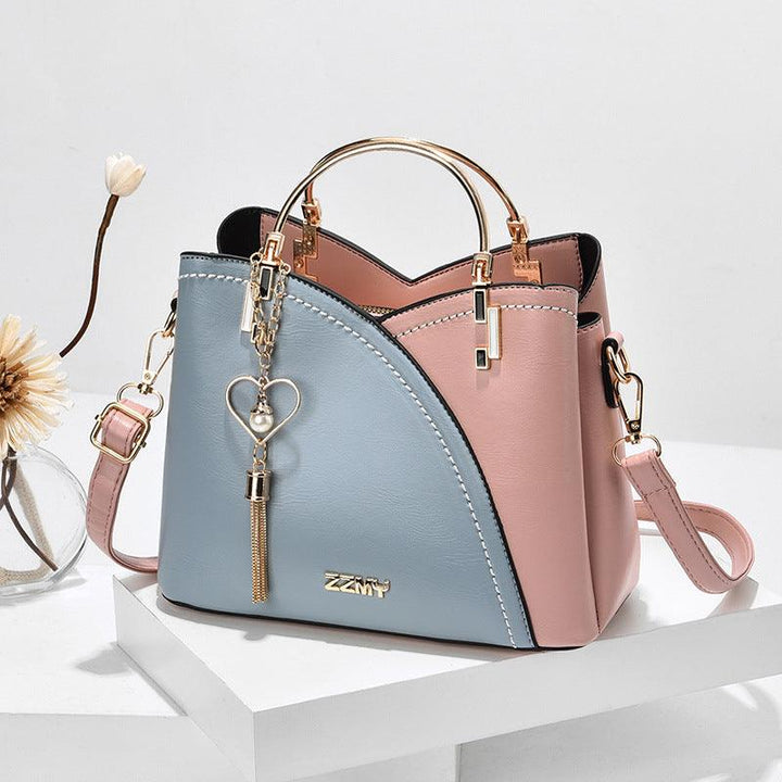 Versatile women's handbag in elegant design, featuring an adjustable strap.