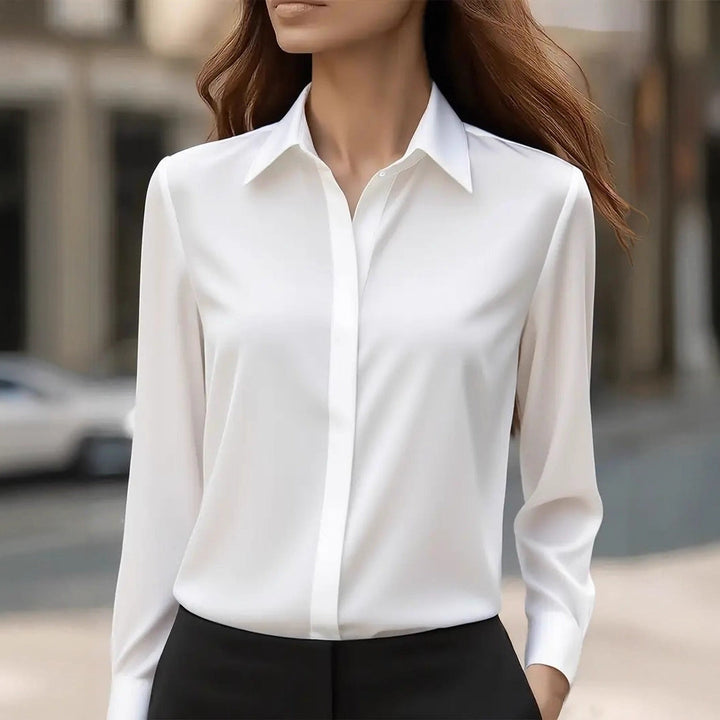 Chic women's silk top showcasing timeless design and elegant apparel.