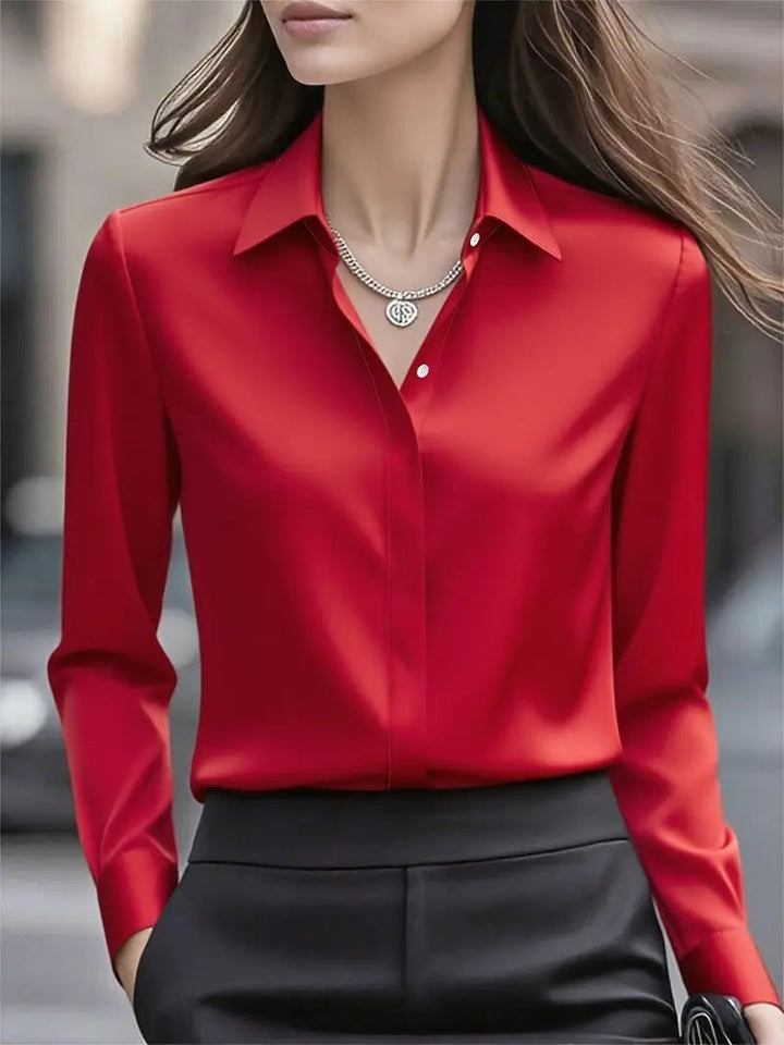 Versatile women's fashion: elegant silk blouse in a classic button-up style.