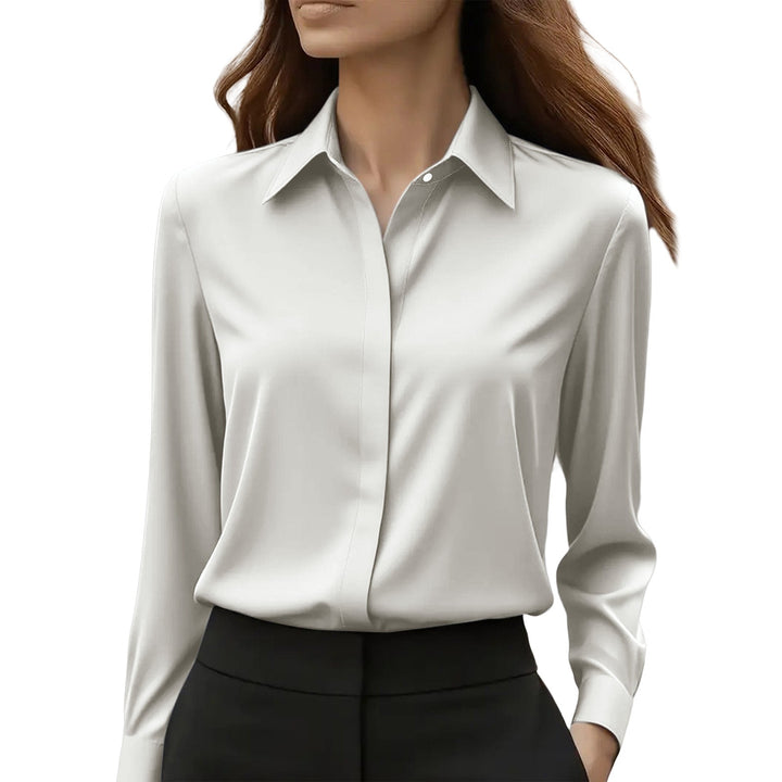 Modern women's silk blouse blending elegance and timeless chic for versatile looks.