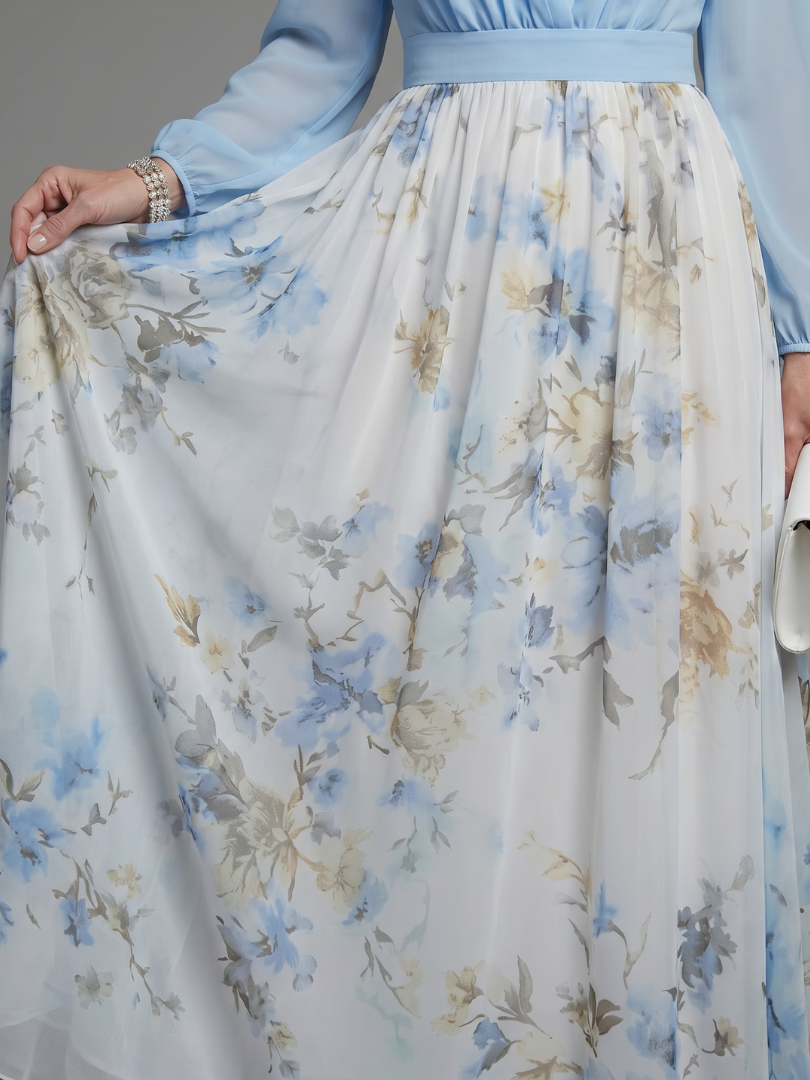 Long flowing sky blue floral maxi dress with a sheer bodice and V-neck for women, an elegant occasion wear.