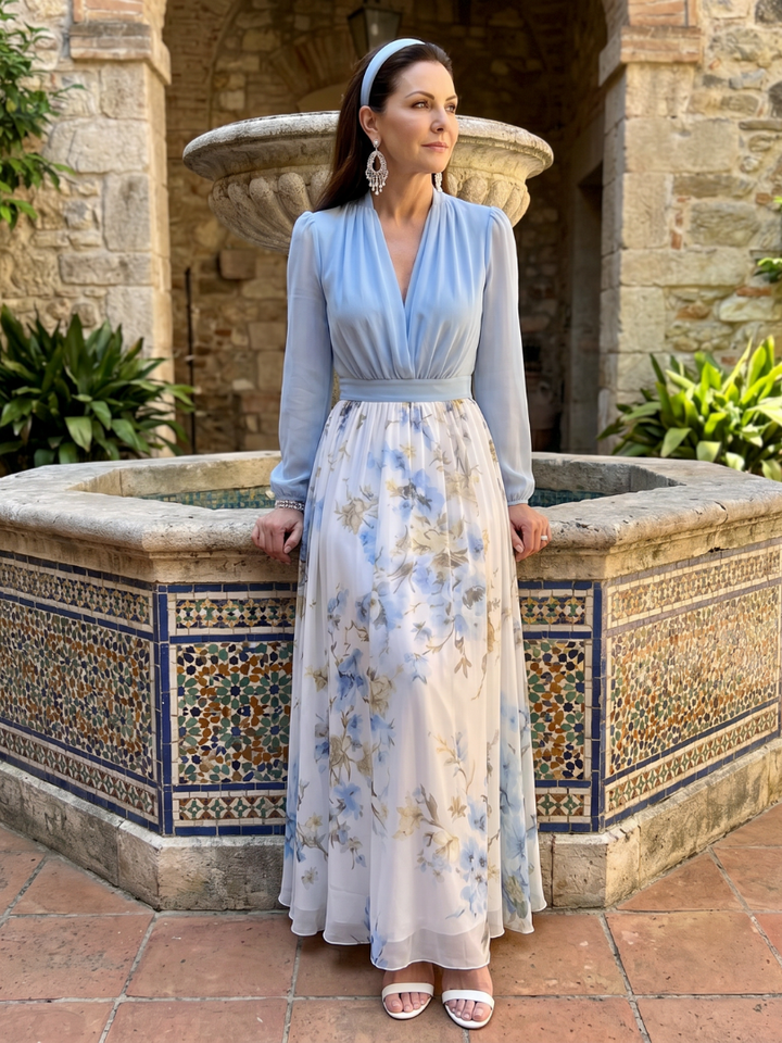 Close-up of a women's sky blue V-neck floral maxi dress showcasing the sheer bodice and print.