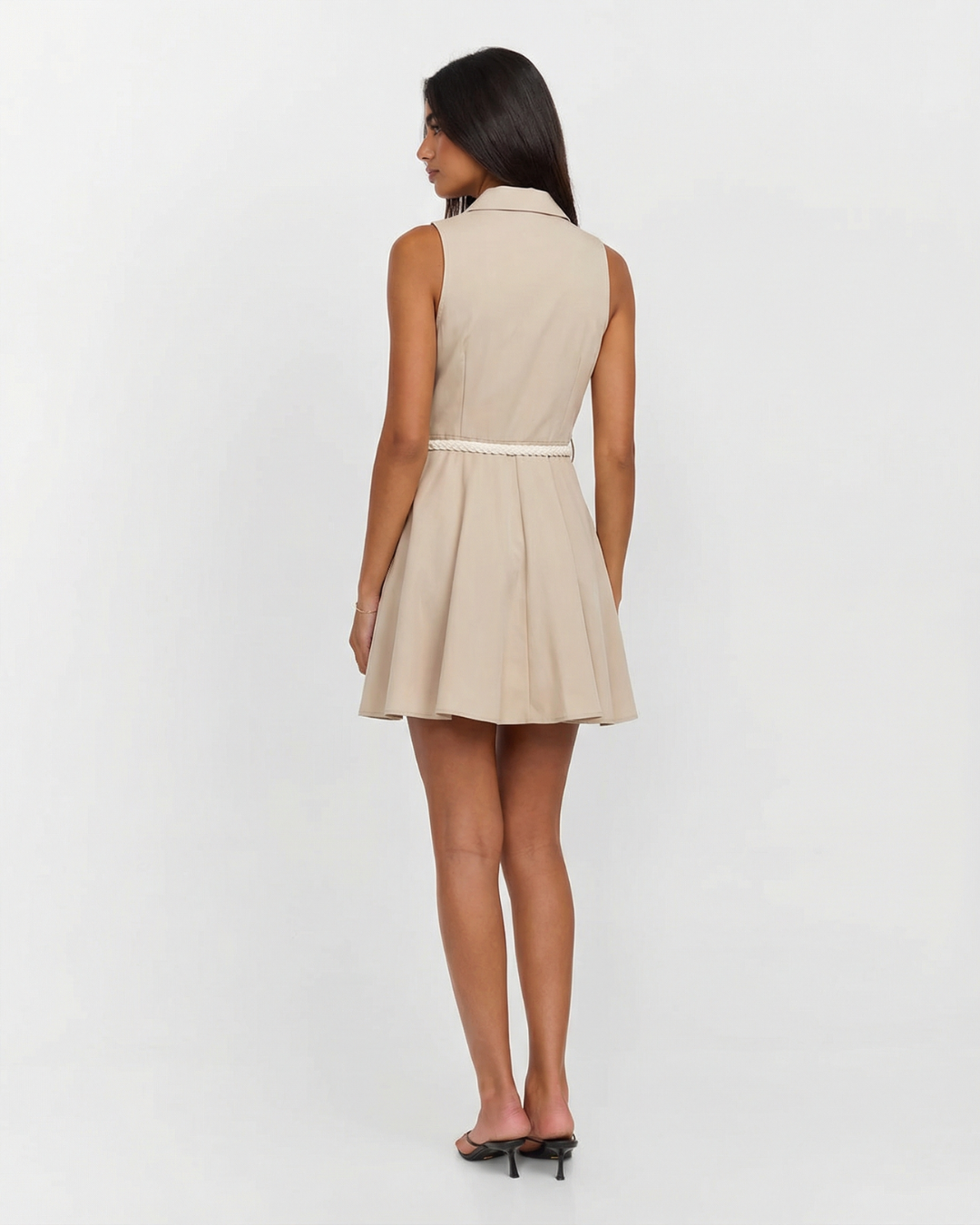 Chic women's beige sleeveless button-front shirt dress. A stylish mini dress perfect for summer fashion & office wear.