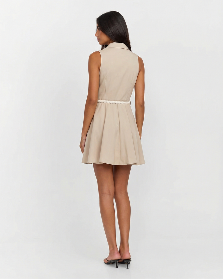 Chic women's beige sleeveless button-front shirt dress. A stylish mini dress perfect for summer fashion & office wear.