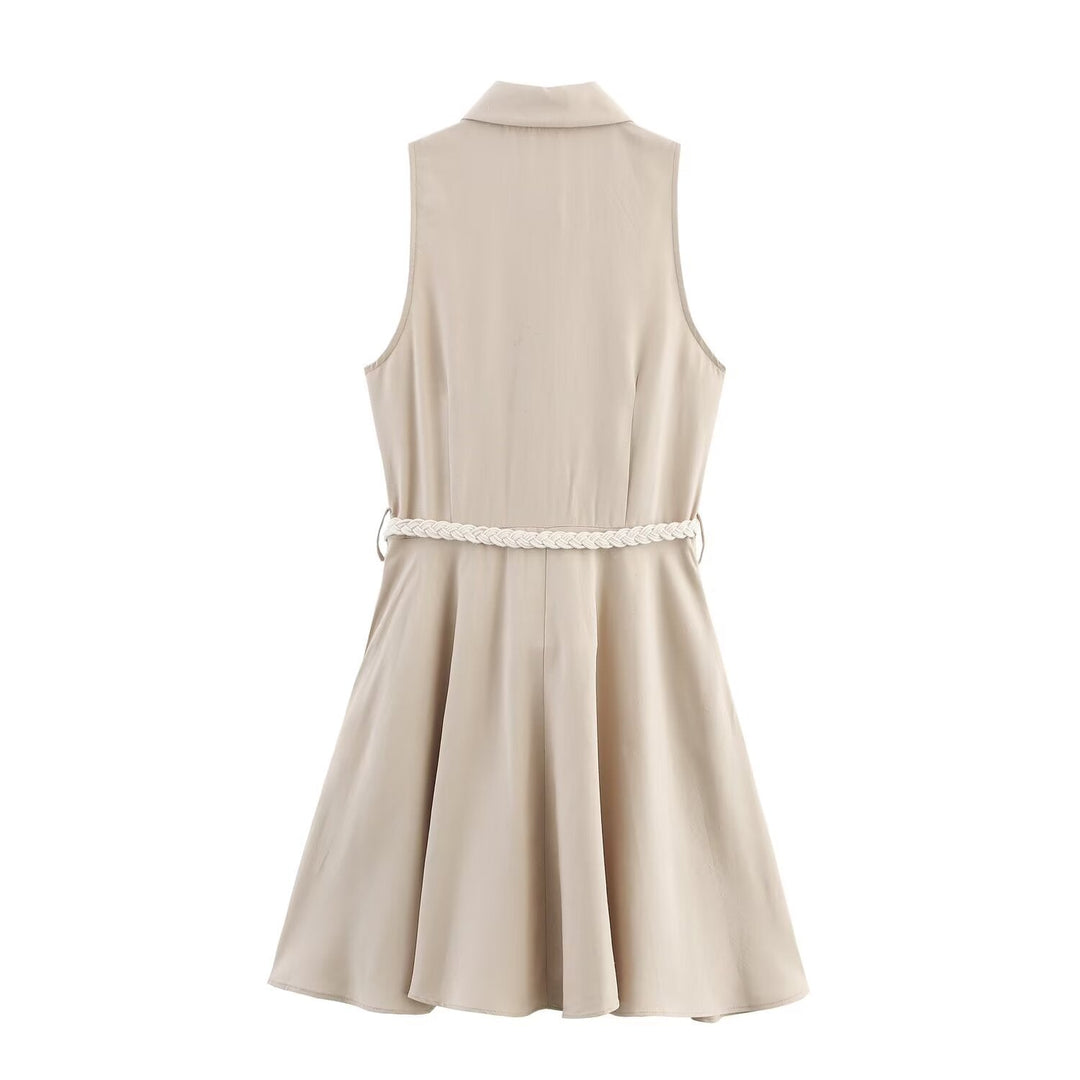Stylish women's beige sleeveless mini dress with elegant button front. A comfortable shirt dress for summer & office.
