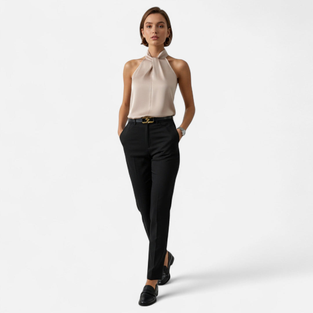 Elegant women's sleeveless blouse with a unique twisted neck design, perfect for chic versatile wear.