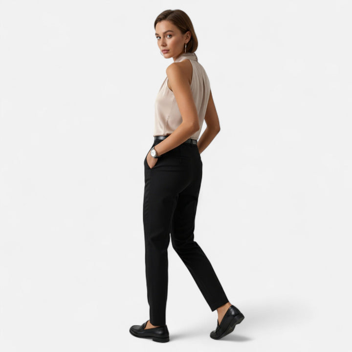 Sophisticated women's sleeveless twisted neck blouse, ideal for formal events or elegant office wear.