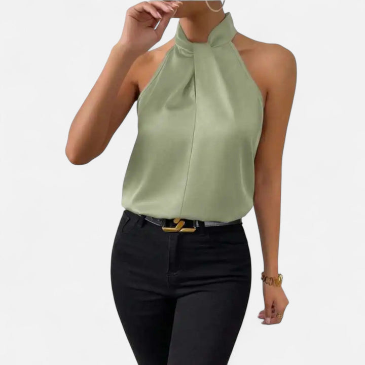 Fashion-forward women's sleeveless blouse with a distinctive twisted neck detail, a truly elegant chic top.