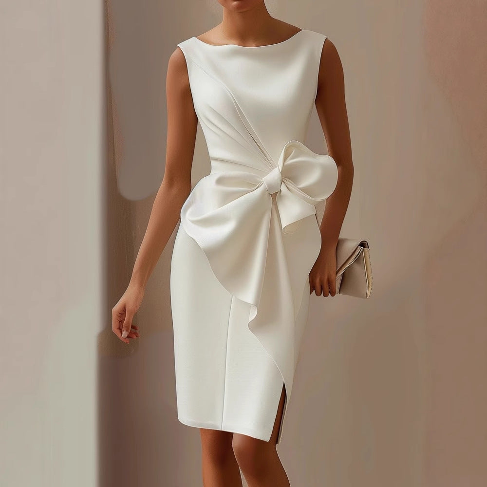 Feminine sleeveless midi dress featuring a classic boat neck and decorative side bow, ideal for wedding guests.