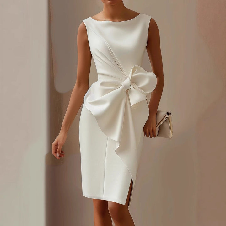 Feminine sleeveless midi dress featuring a classic boat neck and decorative side bow, ideal for wedding guests.