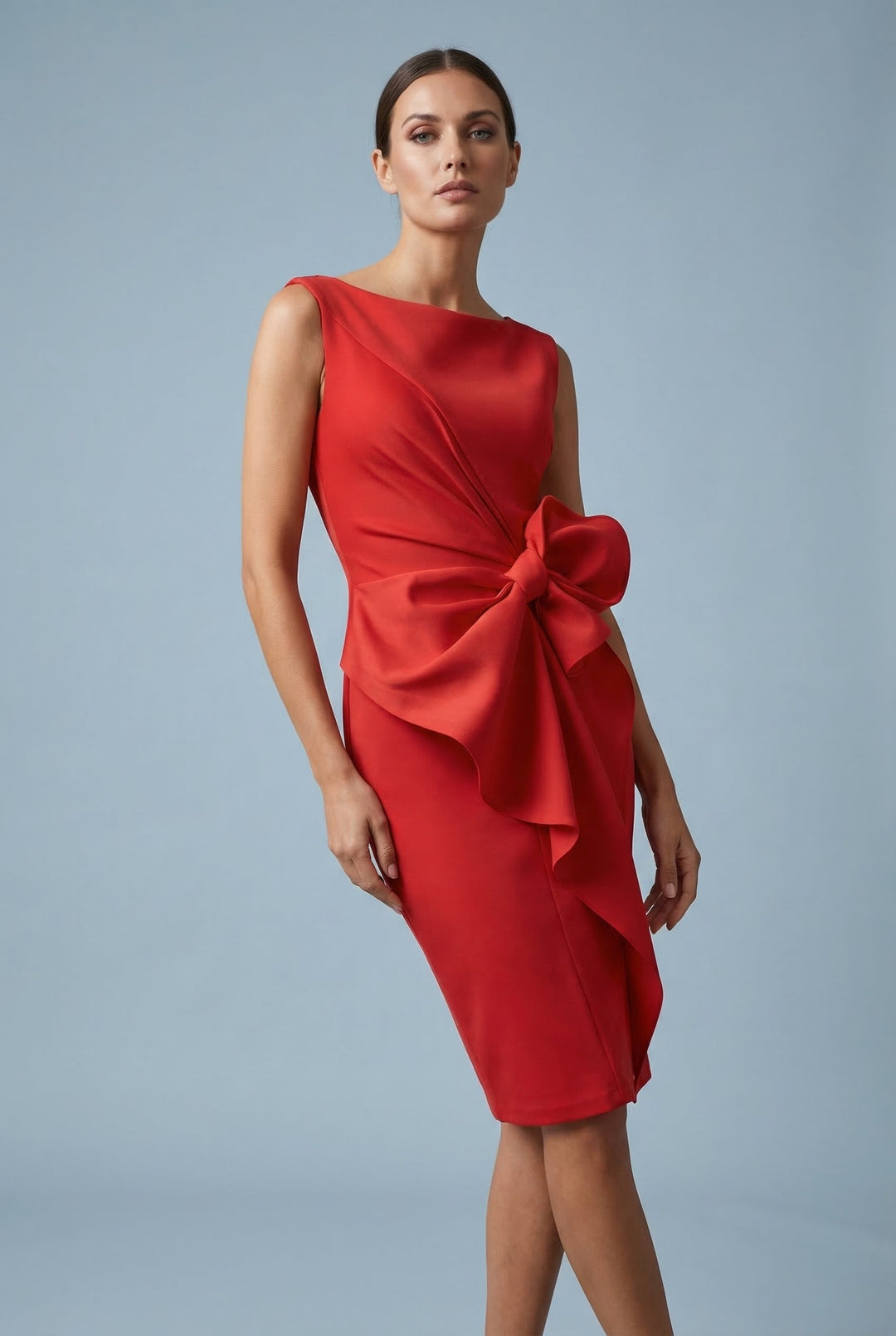 Feminine and elegant sleeveless cocktail dress with a prominent bow.
