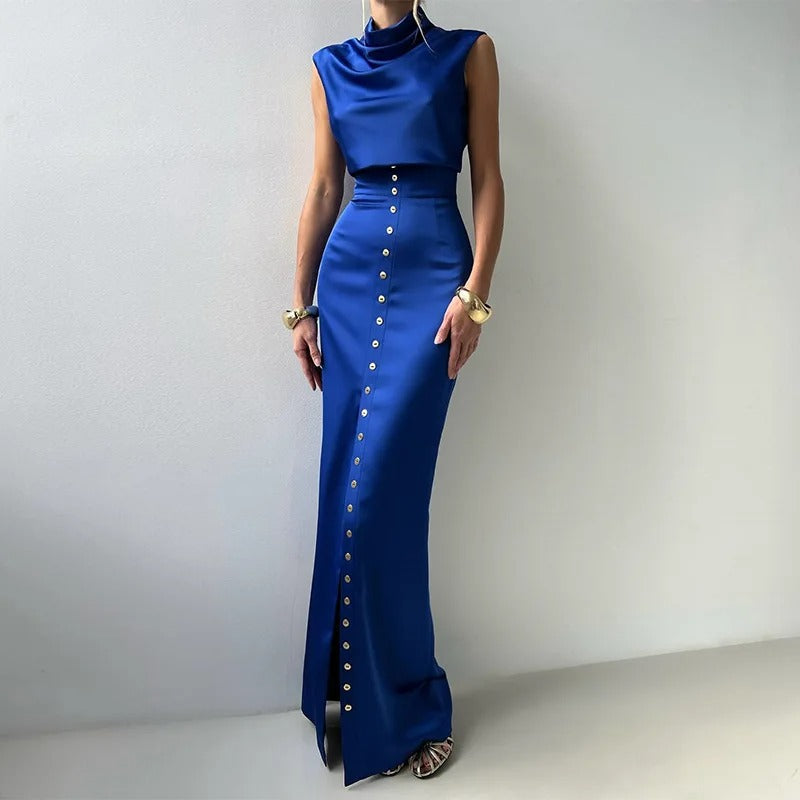 Elegant women's sleeveless button-up two-piece set with cropped top & maxi skirt, perfect for summer fashion.