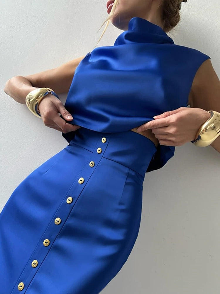 Women's sleeveless button-up cropped top & matching maxi skirt set, stylish and coordinated for summer.