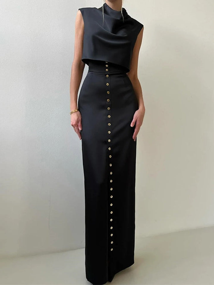 Fashionable women's sleeveless button-up two-piece set, combining a stylish crop top and maxi skirt.