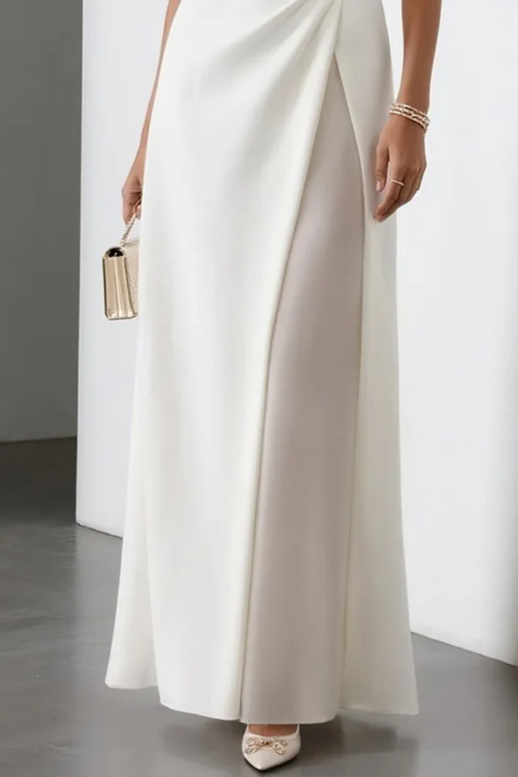 Formal women's elegant sleeveless maxi dress featuring a stylish draped waist, suitable as wedding guest attire.