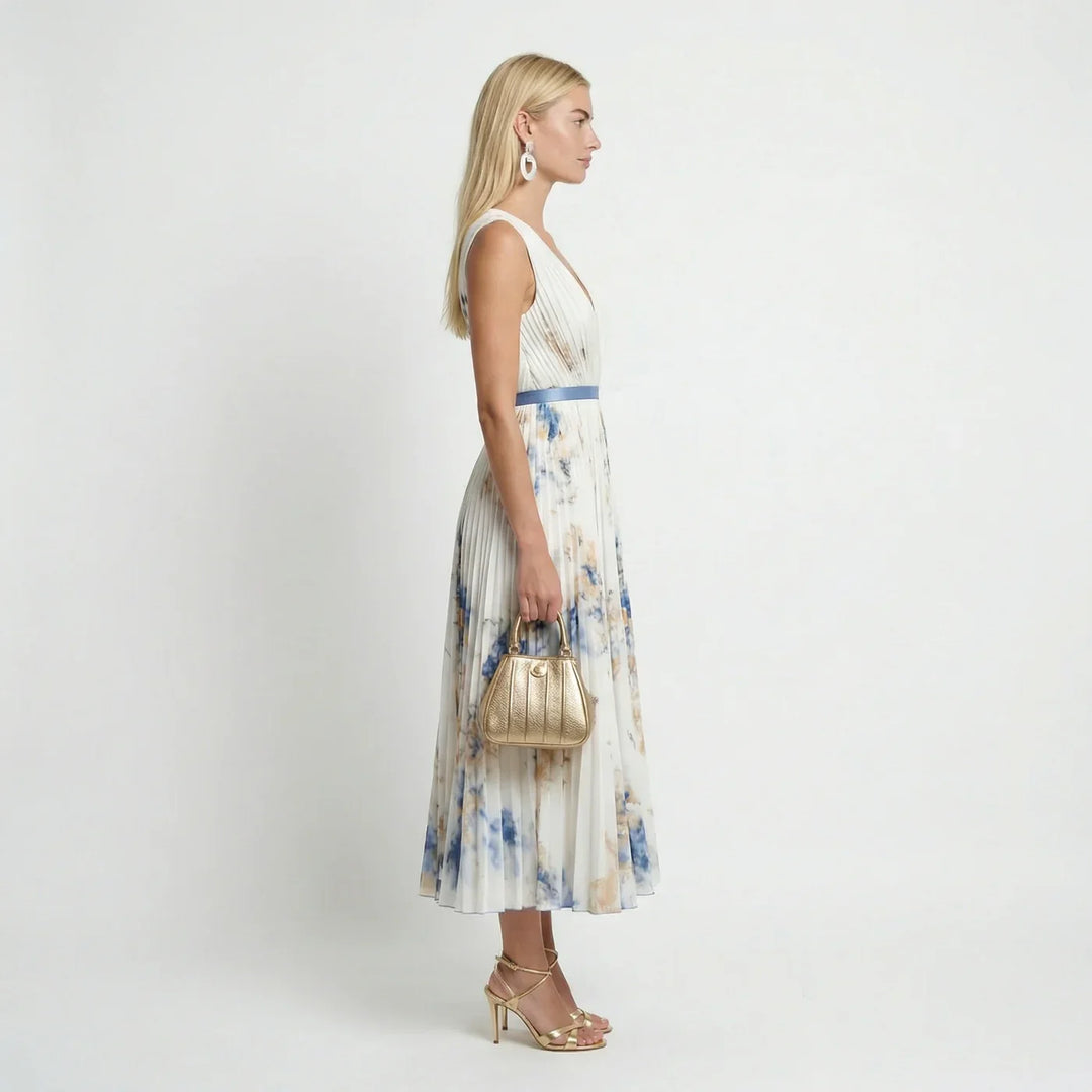 Flowy pleated sleeveless floral maxi dress, perfect for garden parties