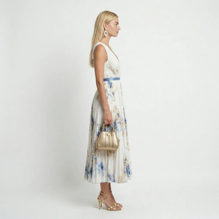 Flowy pleated sleeveless floral maxi dress, perfect for garden parties