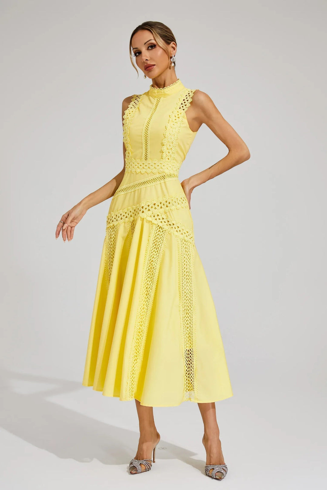 Chic sleeveless lace midi dress for women, ideal as a wedding guest outfit or formal party wear. Elegant design.