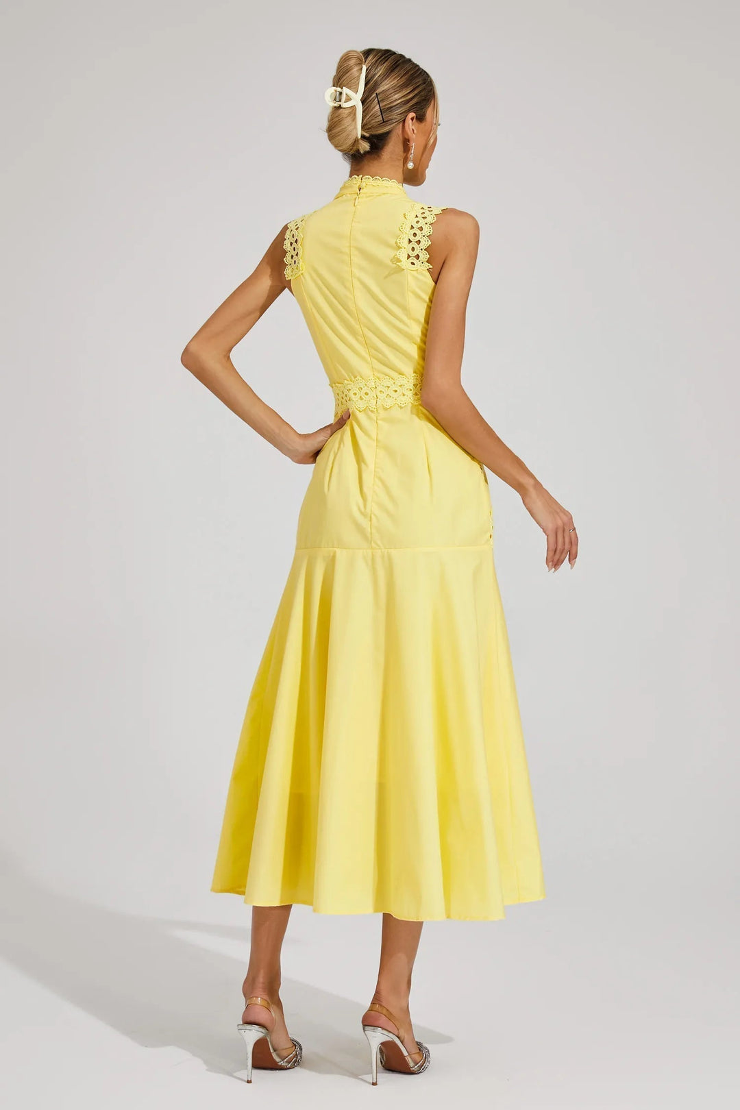 Sophisticated sleeveless lace midi dress for women, featuring intricate lace detailing. Elegant choice for summer events.
