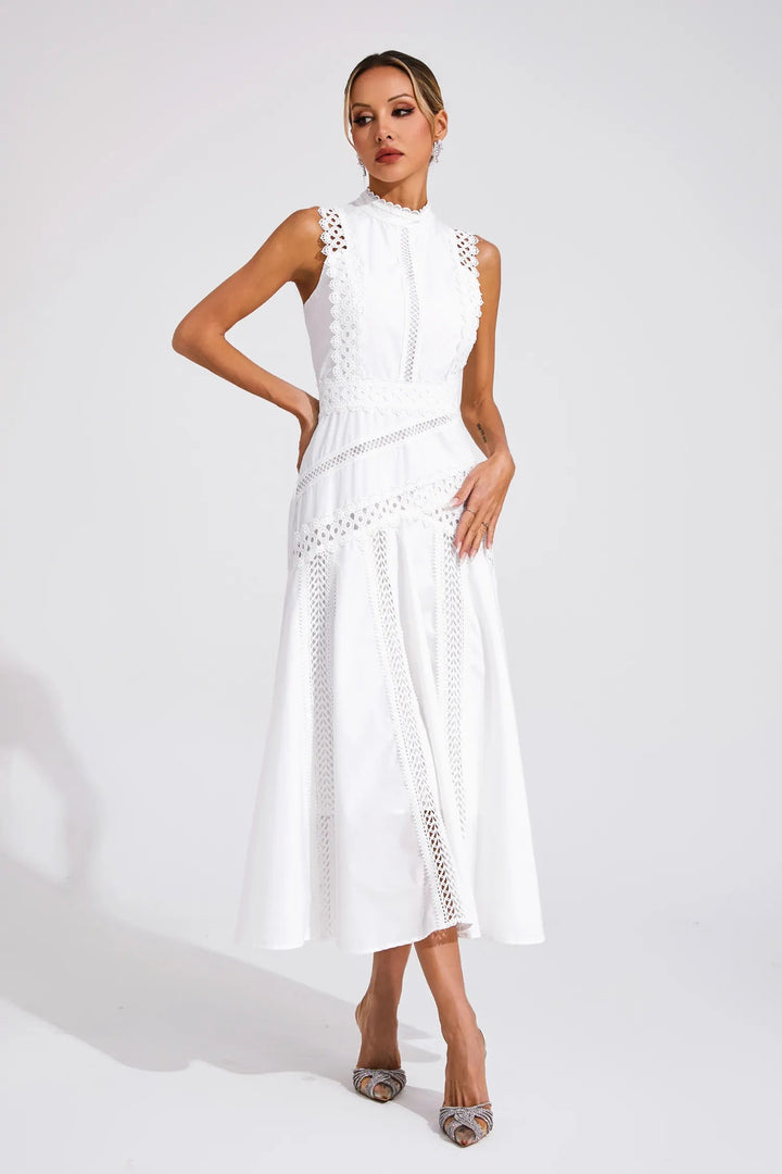 Modern chic sleeveless lace midi dress for women, offering a sophisticated look for wedding guests & formal occasions.