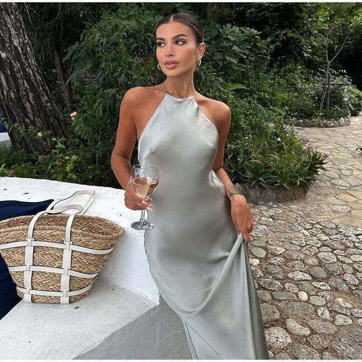Elegant women's sleeveless maxi dress with a sophisticated open back, perfect for formal evening events.