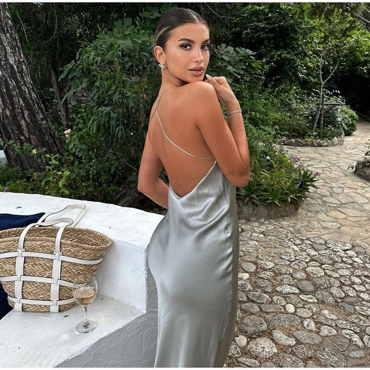 Beautiful women's formal maxi dress with an elegant open back & sleeveless cut, perfect for special occasions.