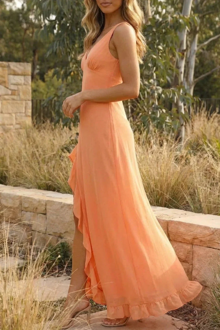 Long sleeveless formal dress for women with a flattering V-neckline & a stylish side split. Ideal for summer wedding guests.