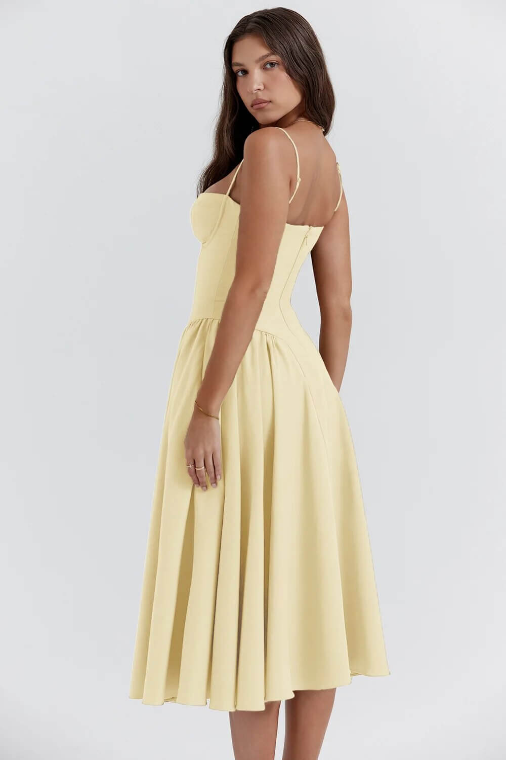 Modern elegant sleeveless midi dress for women, sophisticated corset fit design.