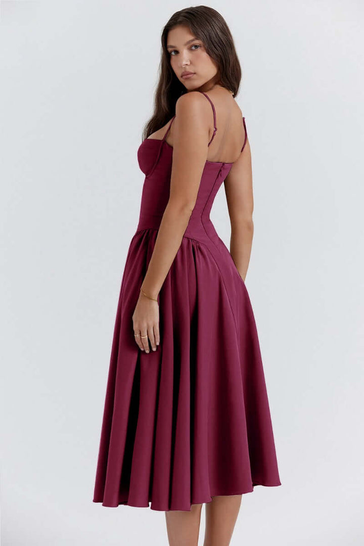 Elegant women's sleeveless midi dress, corset fit accentuating the figure.