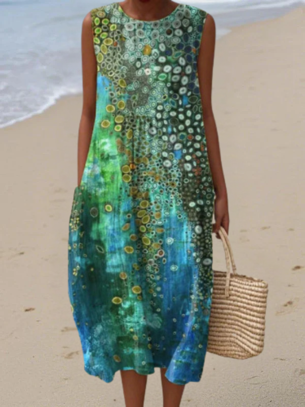 Elegant women's sleeveless midi dress with vibrant reef pattern. Perfect for summer, vacations, or casual chic wear.