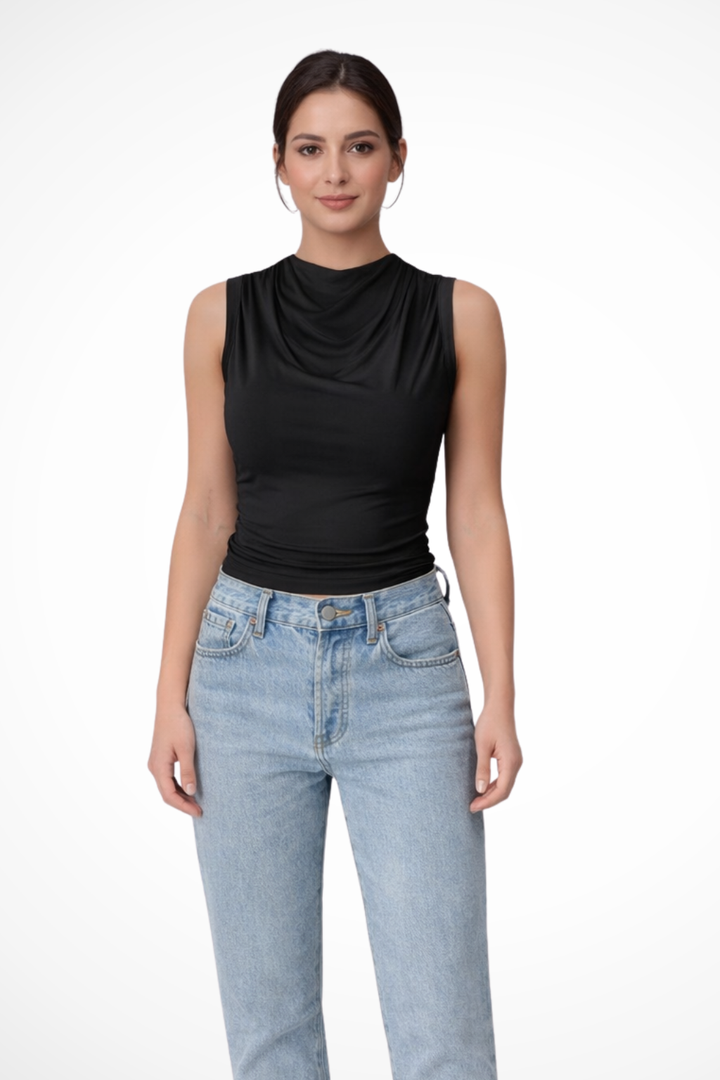 Chic women's sleeveless peplum top featuring a stylish draped neck for an elegant evening look. Fitted fashion top.