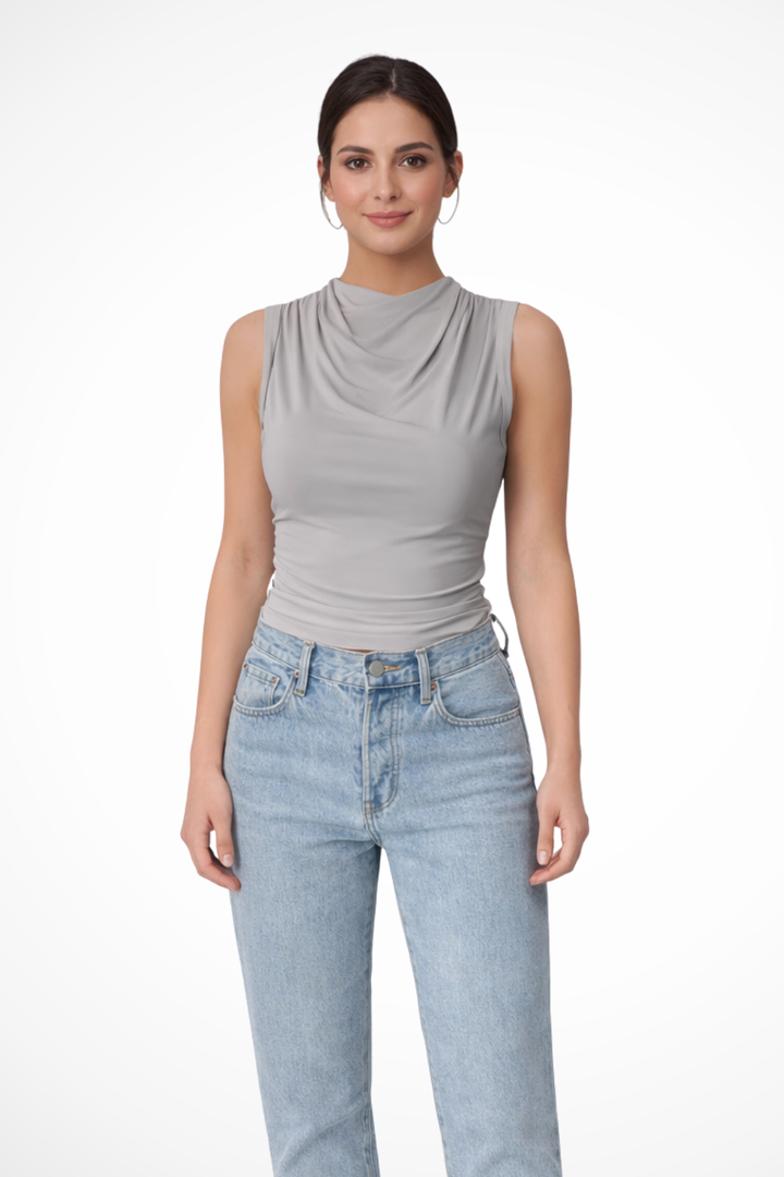 Fashionable women's sleeveless blouse: elegant draped neck peplum top, a stylish addition to any wardrobe.