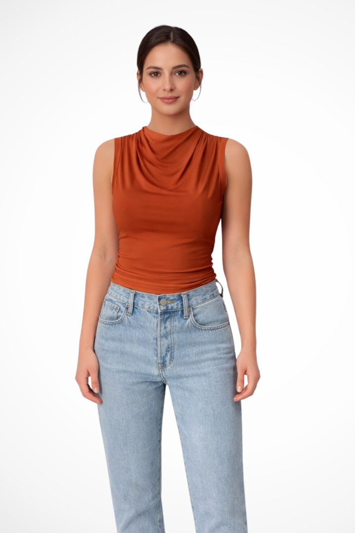 Stylish women's draped neck sleeveless peplum top. A versatile and fitted chic blouse for various occasions.