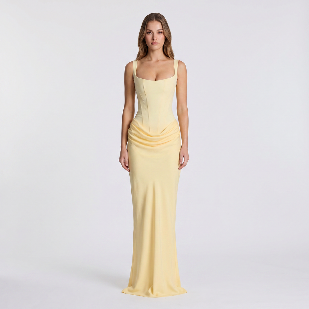 Chic women's sleeveless maxi dress featuring a flattering ruched design & scoop neck. Elegant long dress for any occasion.