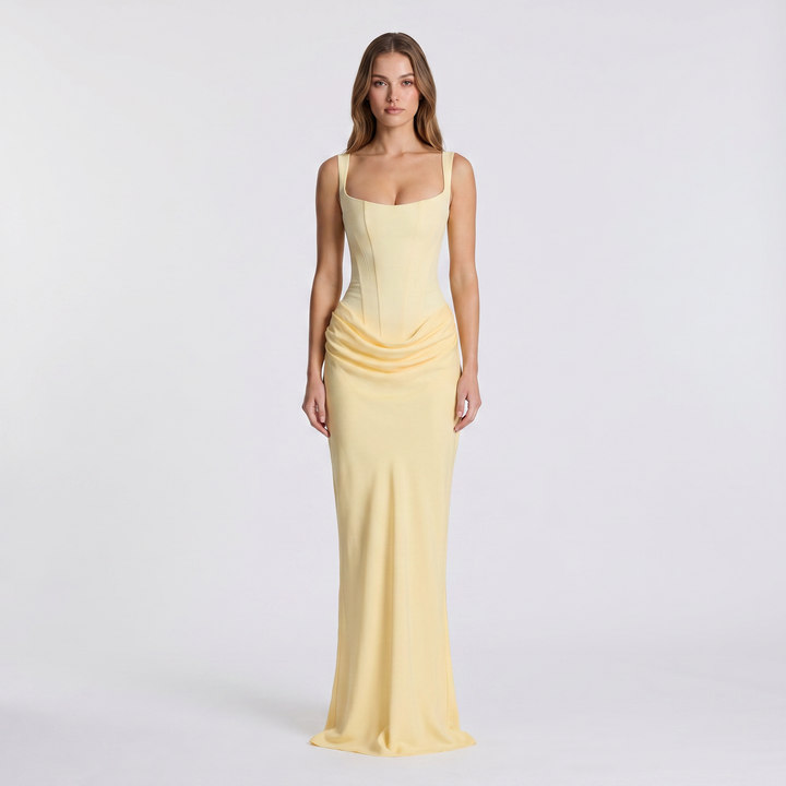 Chic women's sleeveless maxi dress featuring a flattering ruched design & scoop neck. Elegant long dress for any occasion.