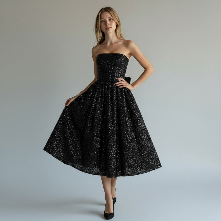 Elegant women's sleeveless sequin midi dress, perfect for evening parties & special occasions. Flowing, chic design.