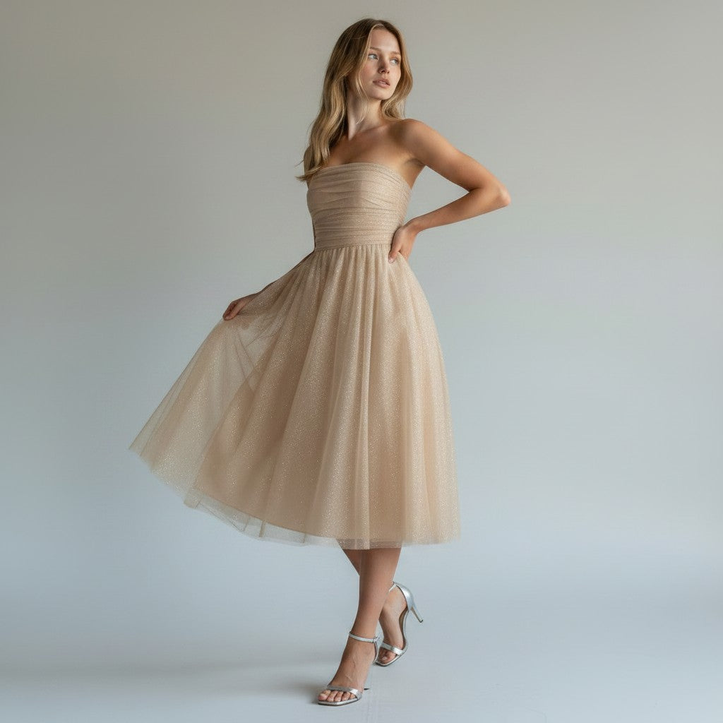 Chic women's flowing midi cocktail dress with shimmering sequins. Ideal for sophisticated evening wear & parties.